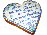 Traditionell beschriftetes Lebkuchenherz mit weier Auflage