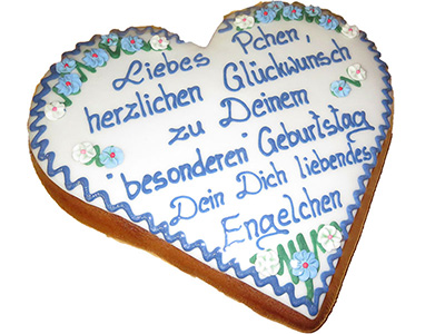 Traditionell beschriftetes Lebkuchenherz mit weier Auflage